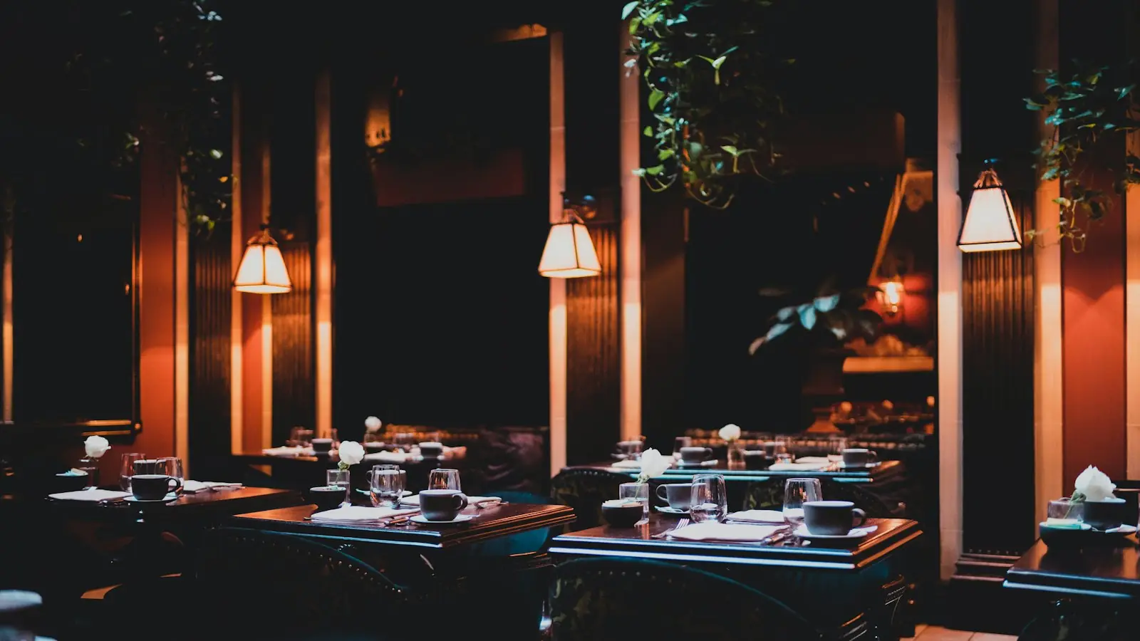 Warm lamps over set tables